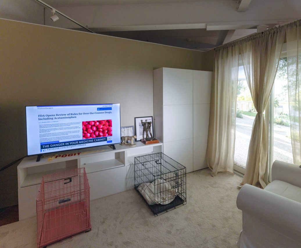 Detail view of the installation's media screens and furniture