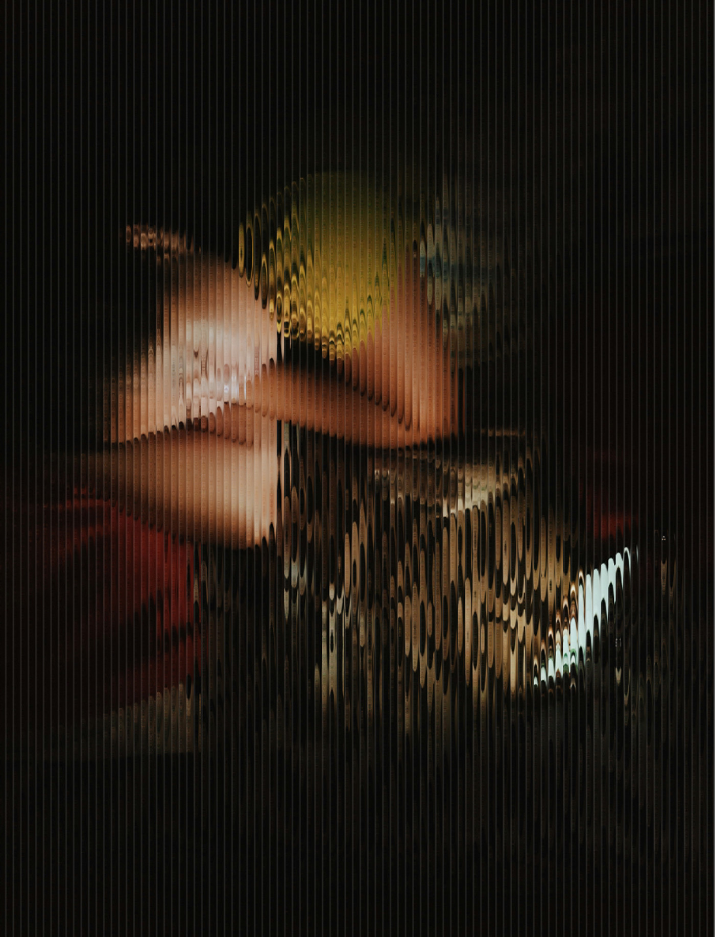 An image of a women lying in a dark bedroom looking at her phone is distorted as if behind wavy glass panels.